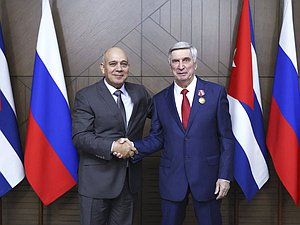 Politburo member, Secretary of the Central Committee of the Communist Party for Organizational Affairs, and member of the National Assembly of People's Power of the Republic of Cuba Roberto Tomás Morales Ojeda and First Deputy Chairman of the State Duma Ivan Melnikov