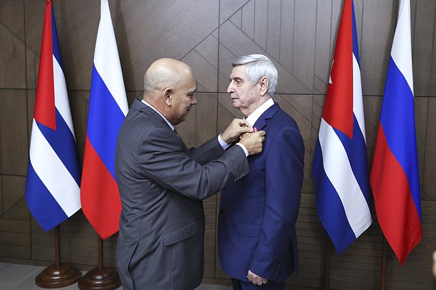 Politburo member, Secretary of the Central Committee of the Communist Party for Organizational Affairs, and member of the National Assembly of People's Power of the Republic of Cuba Roberto Tomás Morales Ojeda and First Deputy Chairman of the State Duma Ivan Melnkikov