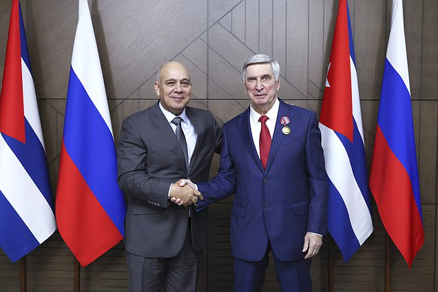 Politburo member, Secretary of the Central Committee of the Communist Party for Organizational Affairs, and member of the National Assembly of People's Power of the Republic of Cuba Roberto Tomás Morales Ojeda and First Deputy Chairman of the State Duma Ivan Melnikov